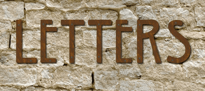 Mission Style House Letters set of 6 by Rustica in rusted metal mounted on a stone wall on Tampa Home & Garden Store