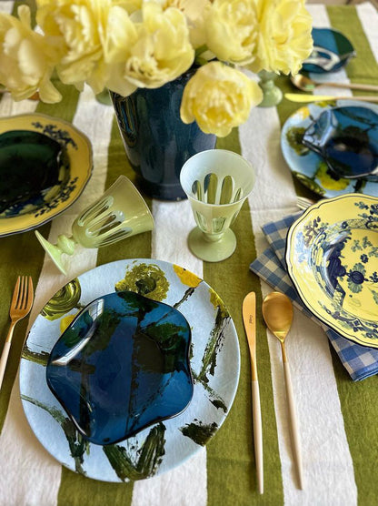 Lemon Posey China Plates by Erin Donahue Tice, blue and yellow pattern with green glassware on Tampa Home & Garden Store