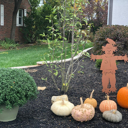 Outdoor scarecrow garden decor Rustica Ornamentals orange silhouette among pumpkins on Tampa Home & Garden Store