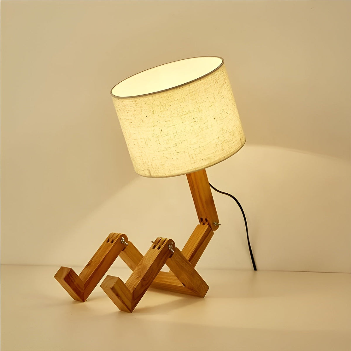 Bamboo table lamp with wooden tripod base and beige fabric shade, Moktan Sabai LED light on Tampa Home & Garden Store