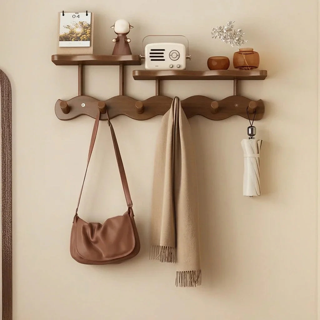 Bamboo wall coat rack with two shelves and five hooks, tan handbag, beige scarf, and umbrella on Tampa Home & Garden Store