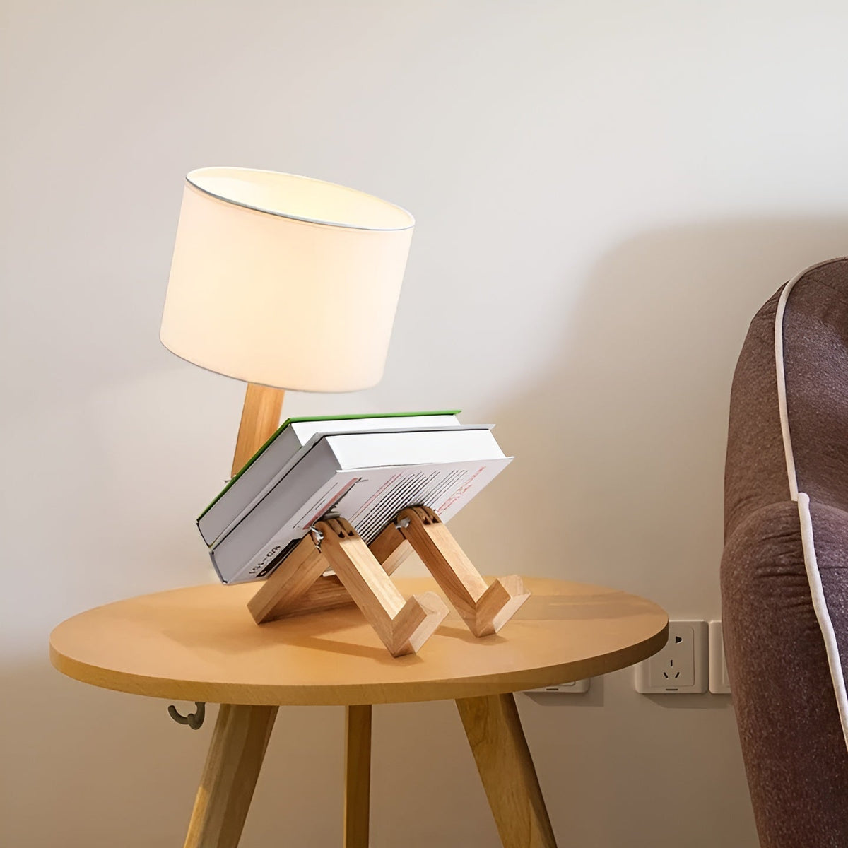 Moktan Sabai bamboo table lamp with natural wooden tripod base and ivory shade, 3-book stack on round table on Tampa Home & Garden Store