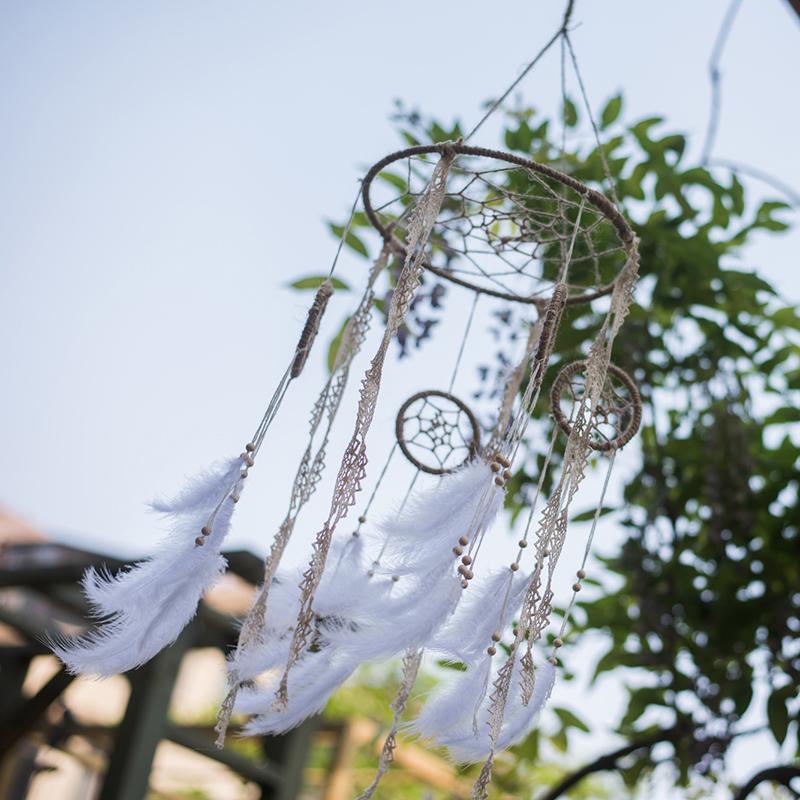 Indiana Dream Catcher Net by RusticReach with beige lace strands and white feathers on Tampa Home & Garden Store