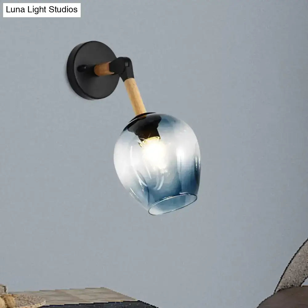 Blue glass globe shade wall sconce with wood arm and black mount by Decorbites on Tampa Home & Garden Store