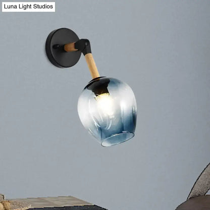 Blue glass globe shade wall sconce with wood arm and black mount by Decorbites on Tampa Home & Garden Store