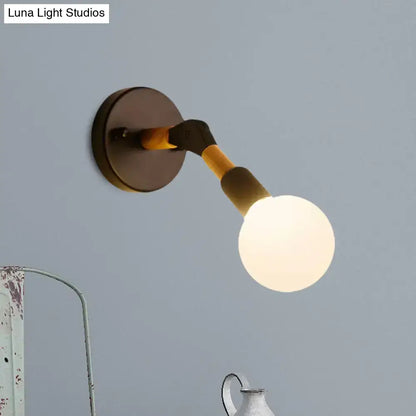 Blue Glass Wall Sconce by Decorbites with round white globe and dark metal backplate on Tampa Home & Garden Store