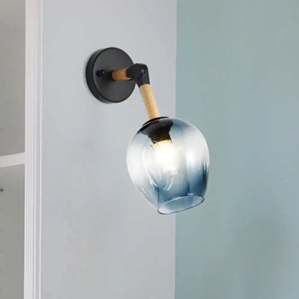 Blue glass wall sconce with wooden arm and black round wall mount by Decorbites on Tampa Home & Garden Store