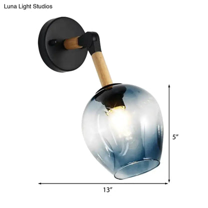 Blue glass wall sconce with black mount and wooden arm, 5in tall by 13in wide Decorbites on Tampa Home & Garden Store