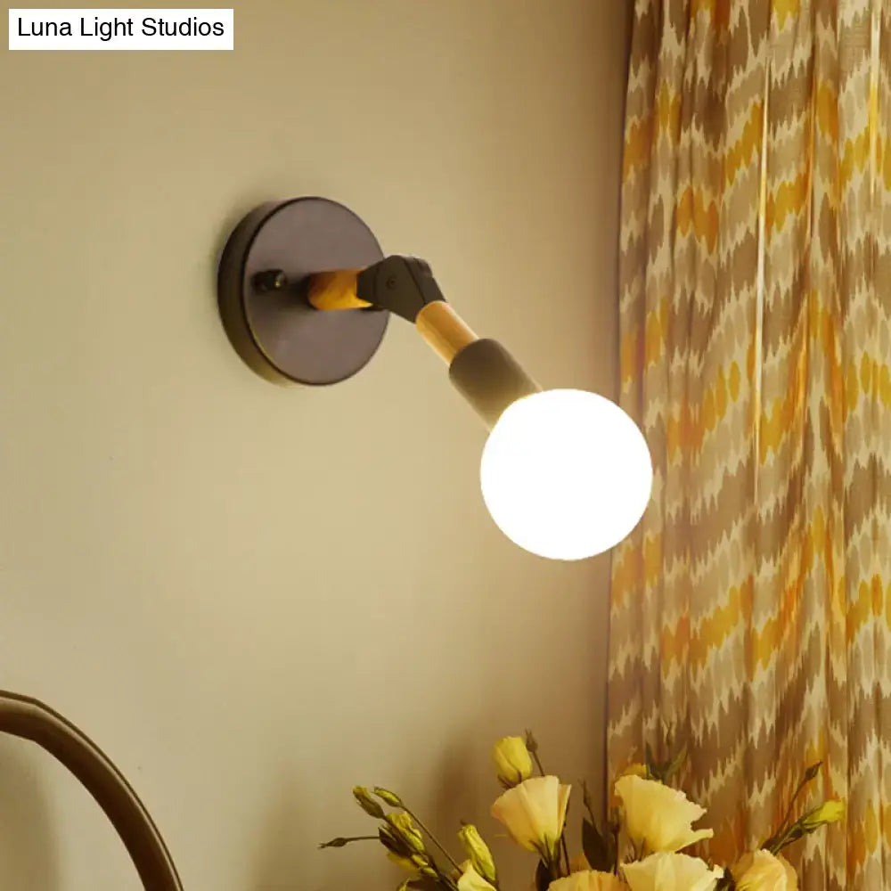 Blue Glass Wall Sconce by Decorbites; round black mount, curved arm, white globe on Tampa Home & Garden Store
