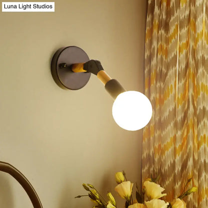 Blue Glass Wall Sconce by Decorbites; round black mount, curved arm, white globe on Tampa Home & Garden Store