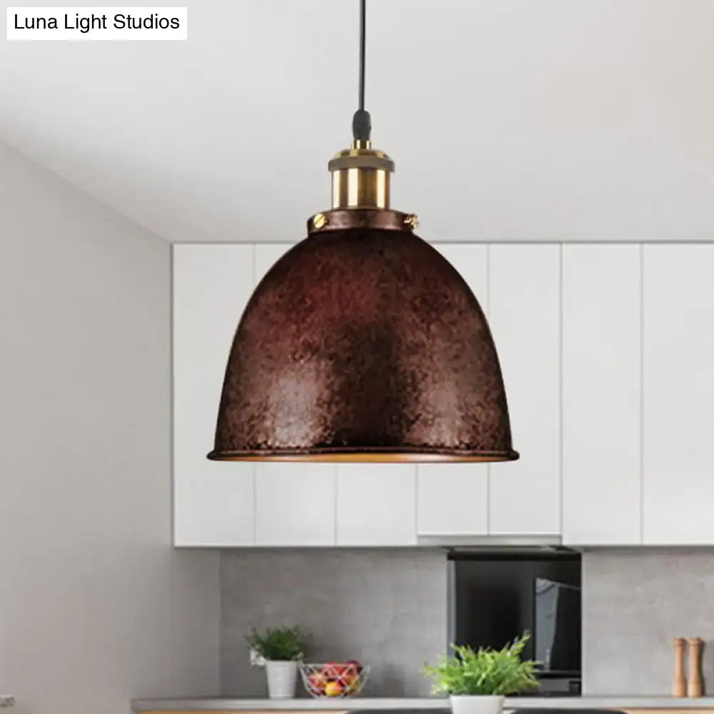 Black dome pendant lamp with hammered copper finish, brass hardware, black cord above kitchen on Tampa Home & Garden Store