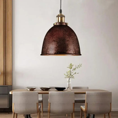 Black Dome Pendant Lamp with hammered-metal shade and brass hardware over a dining table on Tampa Home & Garden Store