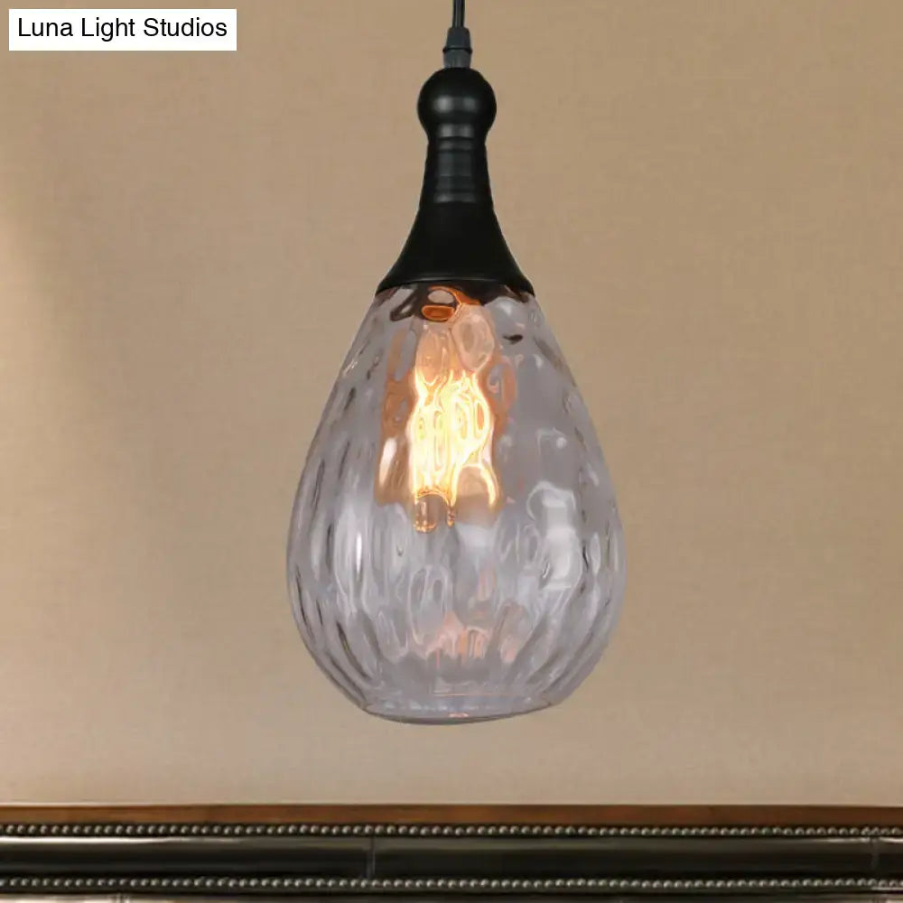 Smoked glass pendant light, teardrop shape with textured surface and warm Edison bulb on Tampa Home & Garden Store