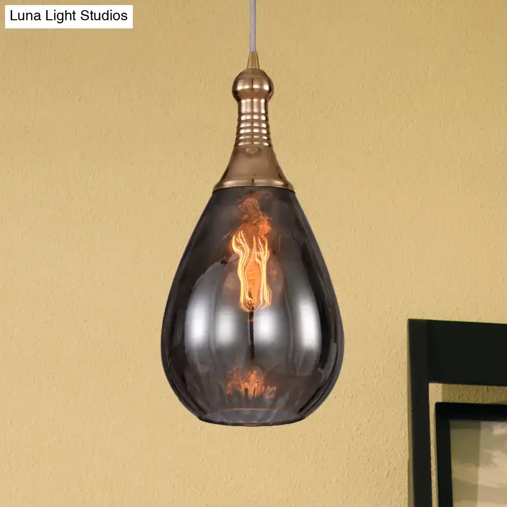 Smoked glass pendant light by Decorbites with brass top and filament bulb, Luna Light Studios on Tampa Home & Garden Store