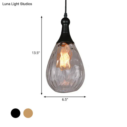 Smoked glass teardrop pendant light with textured surface and warm Edison bulb, black canopy on Tampa Home & Garden Store