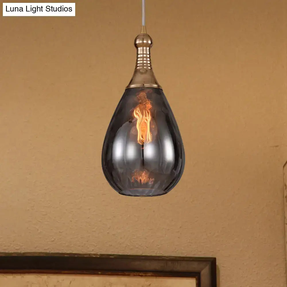Smoked glass pendant light by Decorbites; teardrop shade with brass top on Tampa Home & Garden Store