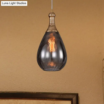 Smoked glass pendant light by Decorbites; teardrop shade with brass top on Tampa Home & Garden Store