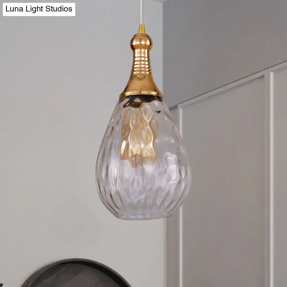 Smoked glass pendant light with brass hardware and a textured teardrop shade Decorbites on Tampa Home & Garden Store