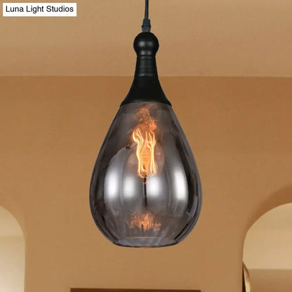 Smoked glass pendant light by Decorbites; Luna Light Studios watermark; teardrop shade on Tampa Home & Garden Store