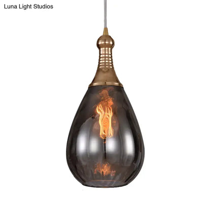 Smoked Glass Pendant Light by Decorbites; teardrop smoky glass shade, brass top on Tampa Home & Garden Store
