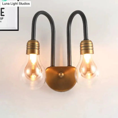 Industrial black & brass two-bulb wall lamp by Decorbites with Edison bulbs for bedroom on Tampa Home & Garden Store