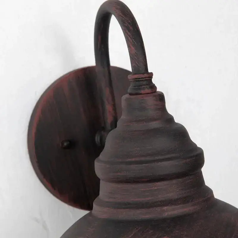Industrial black metal outdoor wall lamp dome sconce with curved arm and distressed finish on Tampa Home & Garden Store