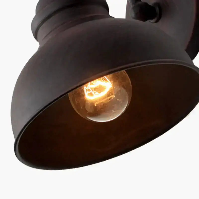 Industrial black metal outdoor wall lamp dome sconce with warm Edison bulb on Tampa Home & Garden Store