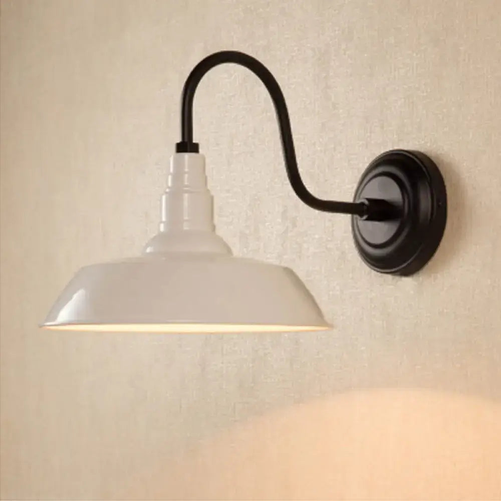 Black metal shade wall sconce by Decorbites with curved arm and white shade on Tampa Home & Garden Store