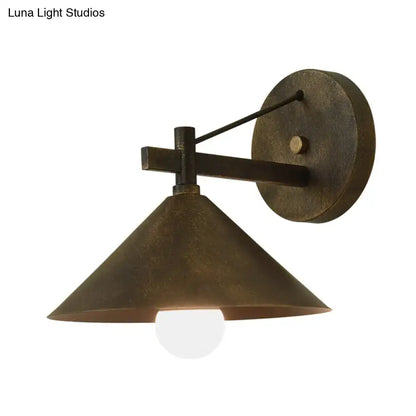 Black metal cone wall sconce by Decorbites, wall-mounted with round backplate on Tampa Home & Garden Store