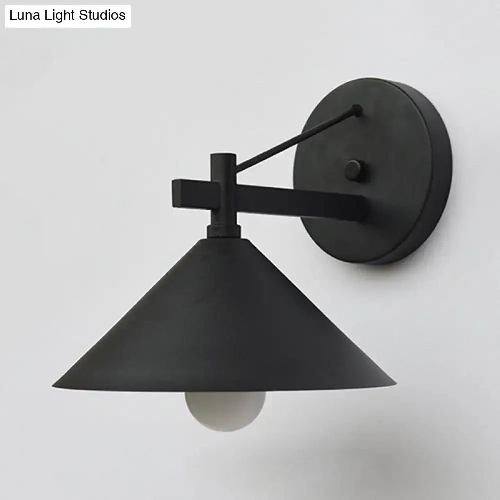 Black metal cone wall sconce by Decorbites; wall mount with round backplate and angled arm on Tampa Home & Garden Store