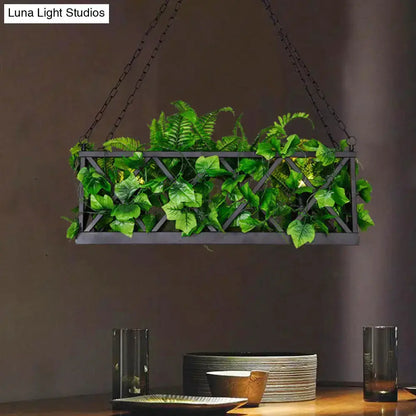 Industrial black rectangular hanging island light with planter by Decorbites, green ferns on Tampa Home & Garden Store