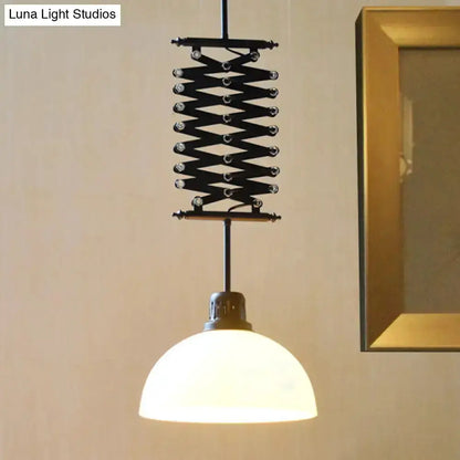 Industrial pendant light with black metal scissor lift and white glass dome shade on Tampa Home & Garden Store