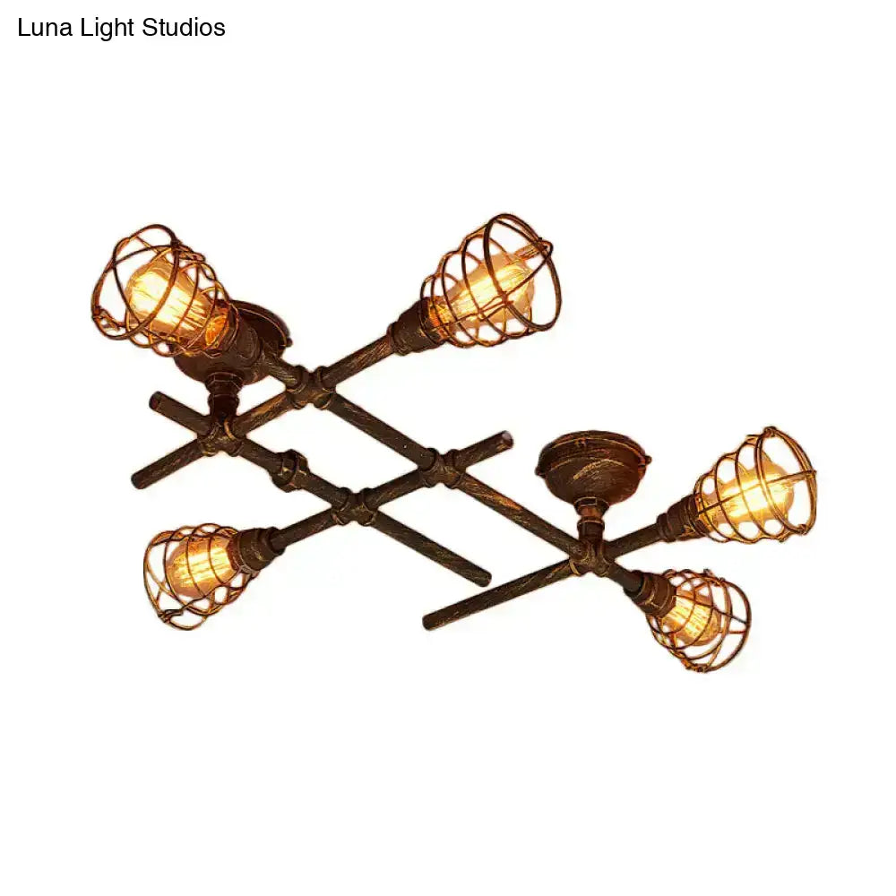 Brass piping ceiling light with five vintage Edison bulbs in wire cages on Tampa Home & Garden Store