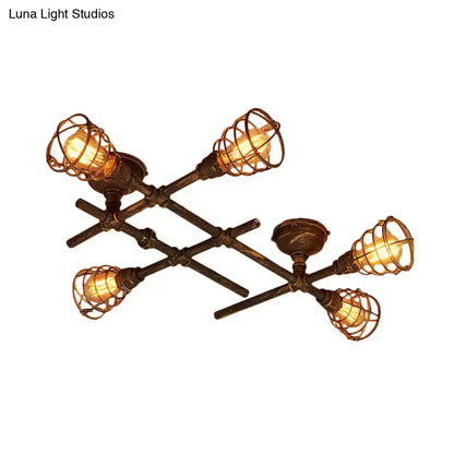 Brass piping ceiling light with five vintage Edison bulbs in wire cages on Tampa Home & Garden Store