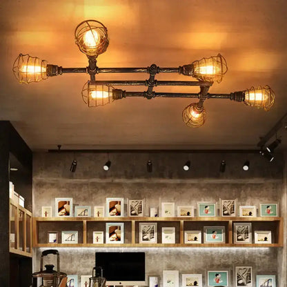 Brass piping ceiling light by Decorbites, multi-arm flush mount with cage guards on Tampa Home & Garden Store