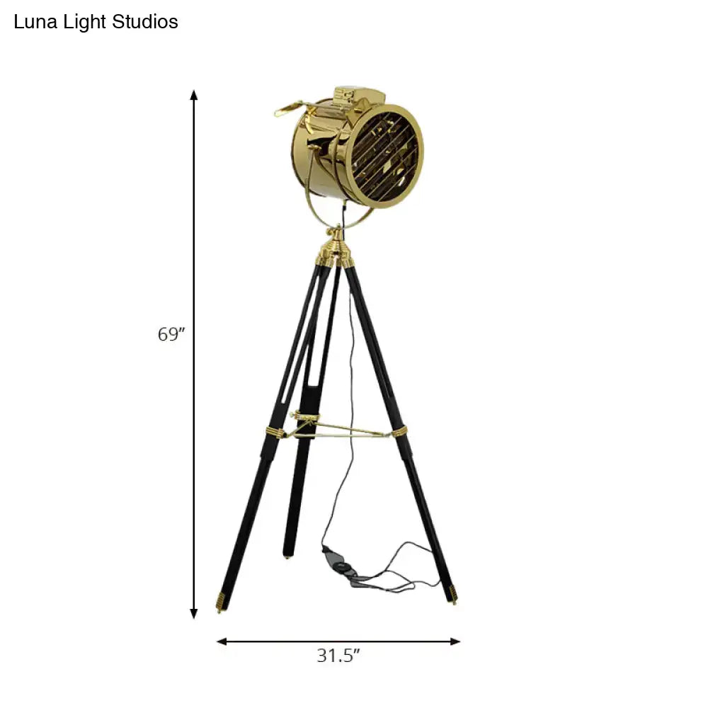 Tripod metal floor lamp Decorbites with black legs and gold spotlight head, 69in tall on Tampa Home & Garden Store