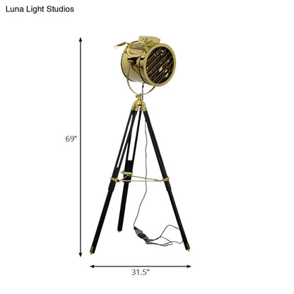 Tripod metal floor lamp Decorbites with black legs and gold spotlight head, 69in tall on Tampa Home & Garden Store