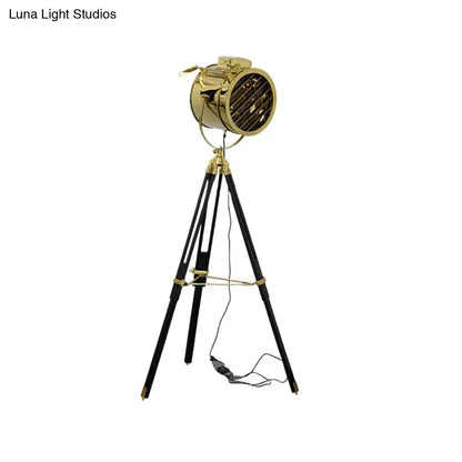 Tripod metal floor lamp with black legs and gold spotlight head by Decorbites for Modern Home on Tampa Home & Garden Store