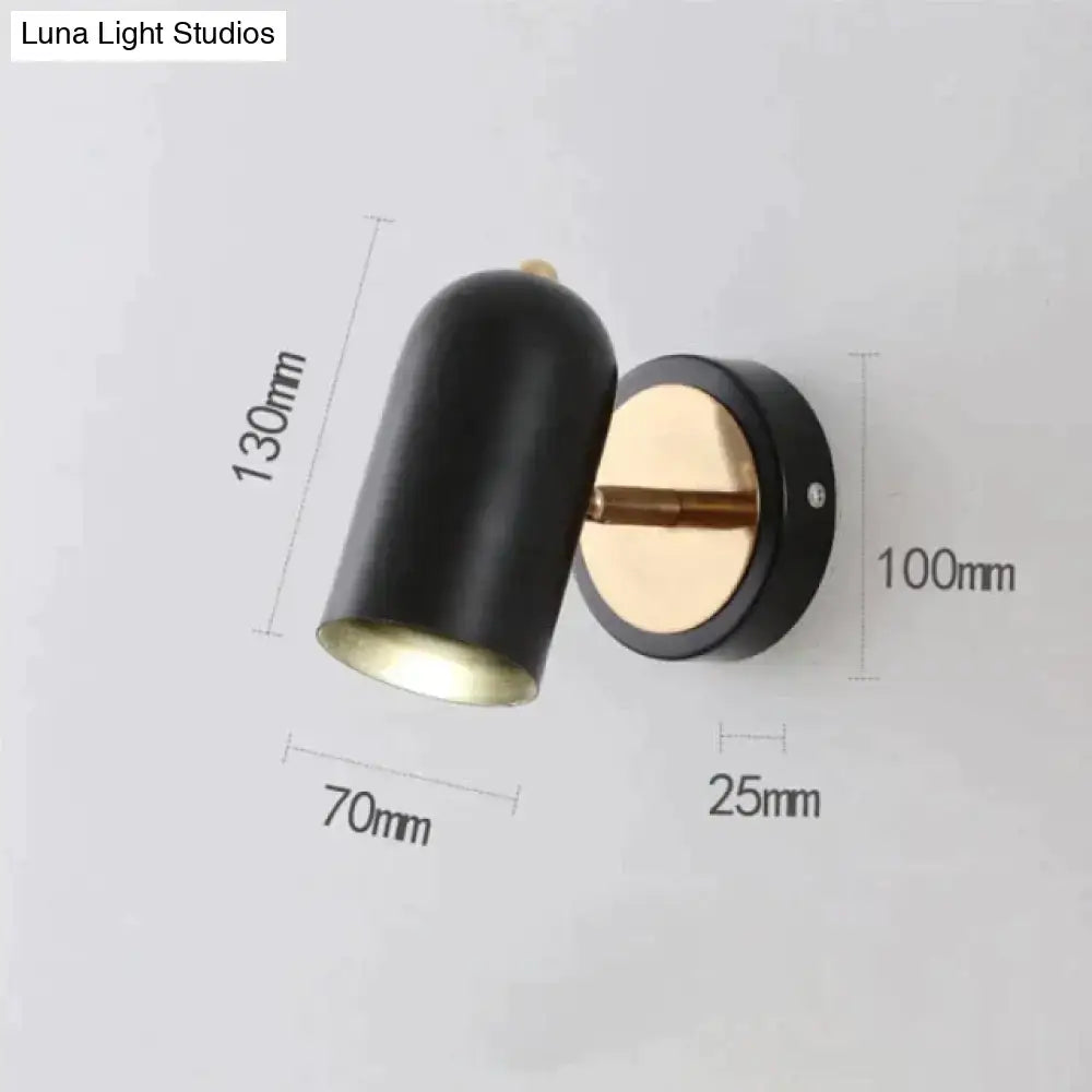 Nickel LED Wall Sconce black cylindrical shade with brass interior, wall mounted on Tampa Home & Garden Store