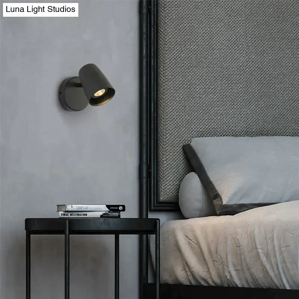 Nickel LED Wall Sconce by Decorbites mounted on gray wall beside bed on Tampa Home & Garden Store
