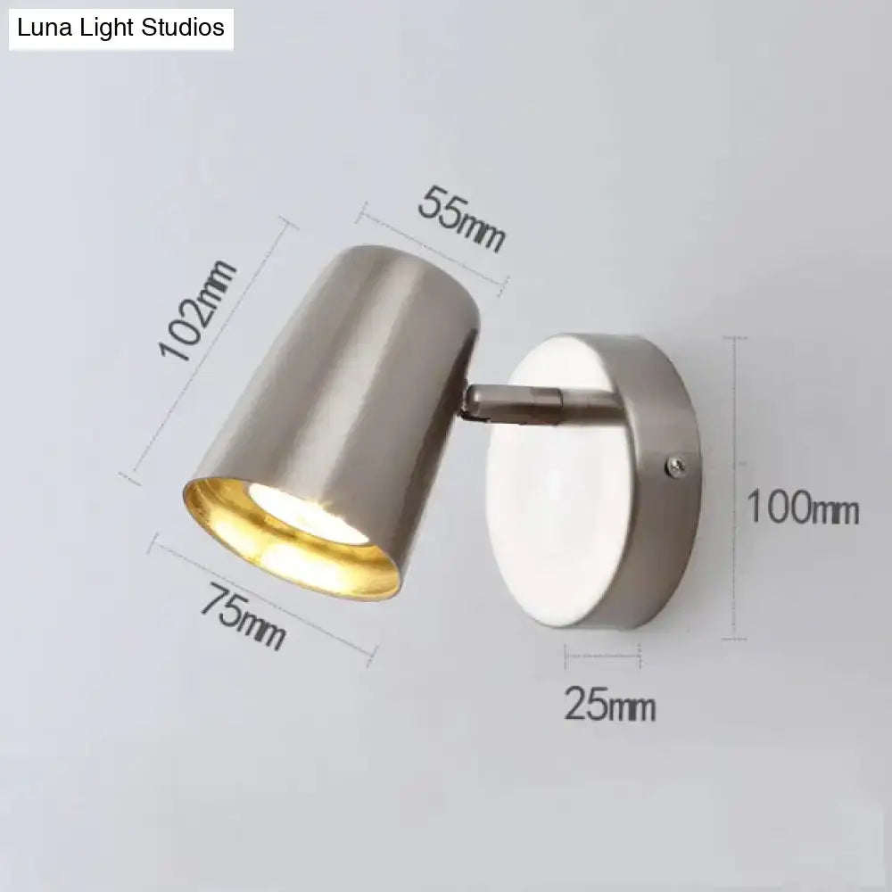 Decorbites nickel LED wall sconce with cylindrical shade and white backplate on Tampa Home & Garden Store