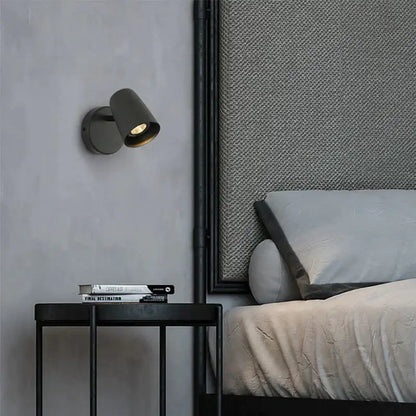 Nickel LED Wall Sconce Decorbites wall light on gray wall above black nightstand on Tampa Home & Garden Store