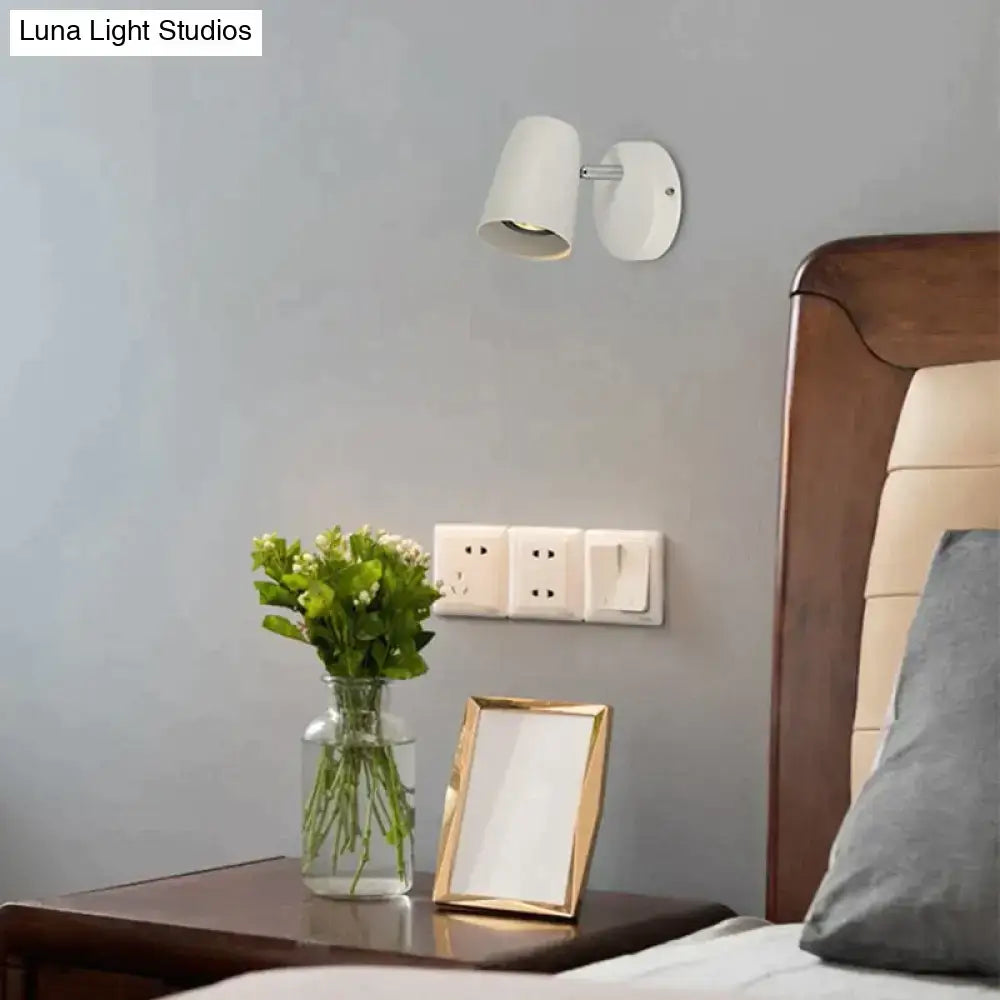 Nickel LED Wall Sconce with white shade, wall-mounted above bedside table by Decorbites on Tampa Home & Garden Store