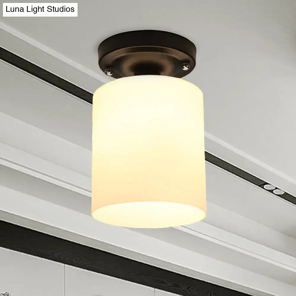 Bronze milky glass ceiling light fixture with cylindrical shade on Tampa Home & Garden Store
