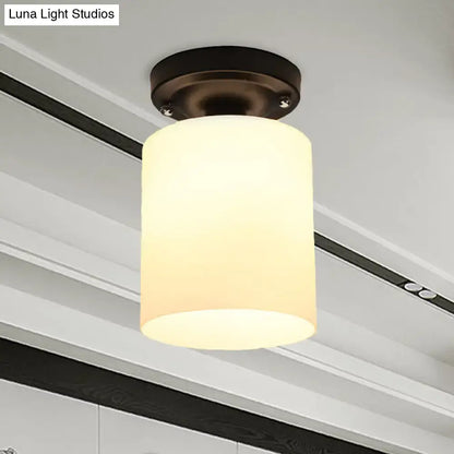 Bronze milky glass ceiling light fixture with cylindrical shade on Tampa Home & Garden Store