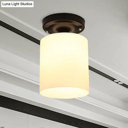 Decorbites Bronze Milky Glass Light ceiling fixture with bronze canopy and cylindrical milk glass shade on Tampa Home & Garden Store