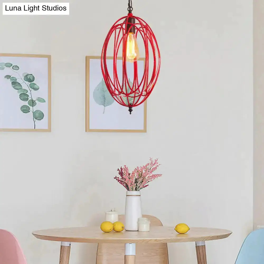 Industrial red oval cage pendant light by Decorbites with exposed bulb over round dining table on Tampa Home & Garden Store