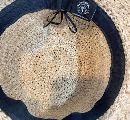 Raffia sun hat by Womanswork, woven straw with black fabric band, interior view on Tampa Home & Garden Store