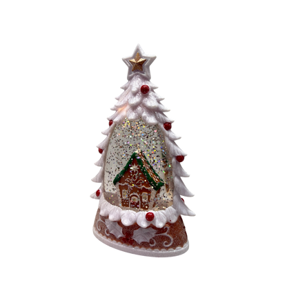 Lighted gingerbread house water globe with a frosted white tree and gold star topper on Tampa Home & Garden Store
