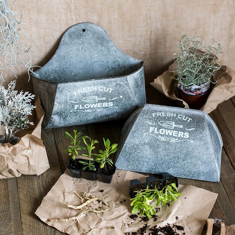 Iron Flower Wall Planter by RusticReach; 2 gray metal planters featuring Fresh Cut Flowers on Tampa Home & Garden Store
